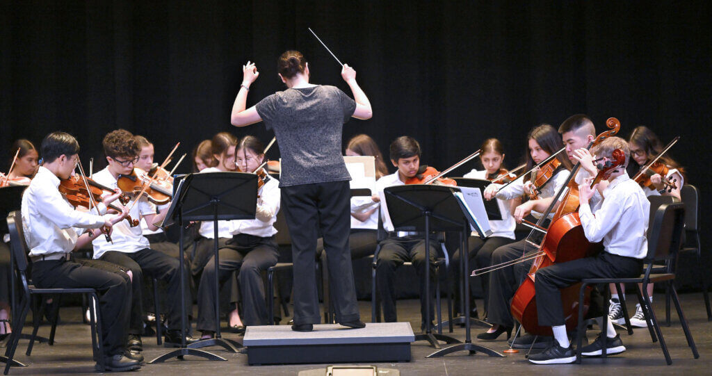 The combined Acton Middle School orchestra performs during a ribbon cutting program for the Ellen Garrison Building at Acton Middle School on Wednesday, June 11, 2025. Ken McGagh/The Acton Bridge