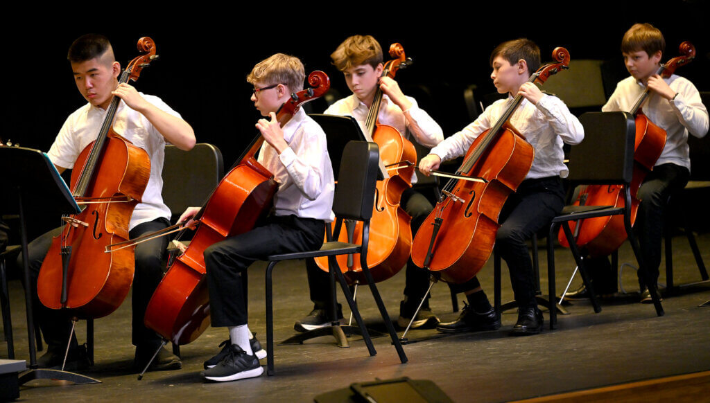 Students in the combined Acton Middle School orchestra perform during a ribbon cuttting ceremony for the Ellen Garrison Building at Acton Middle School on Wednesday, June 11, 2025. Ken McGagh/The Acton Bridge