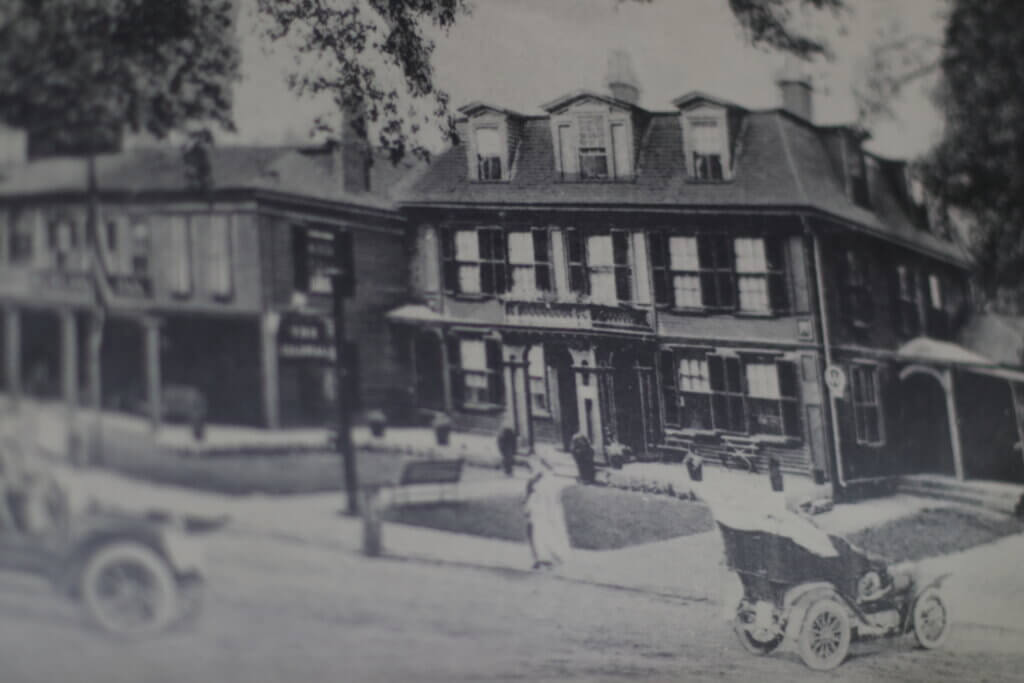 An old photograph of Colonial Inn hangs on the wall of the room called The Salon. Photo: Trace Salzbrenner/The Acton Bridge