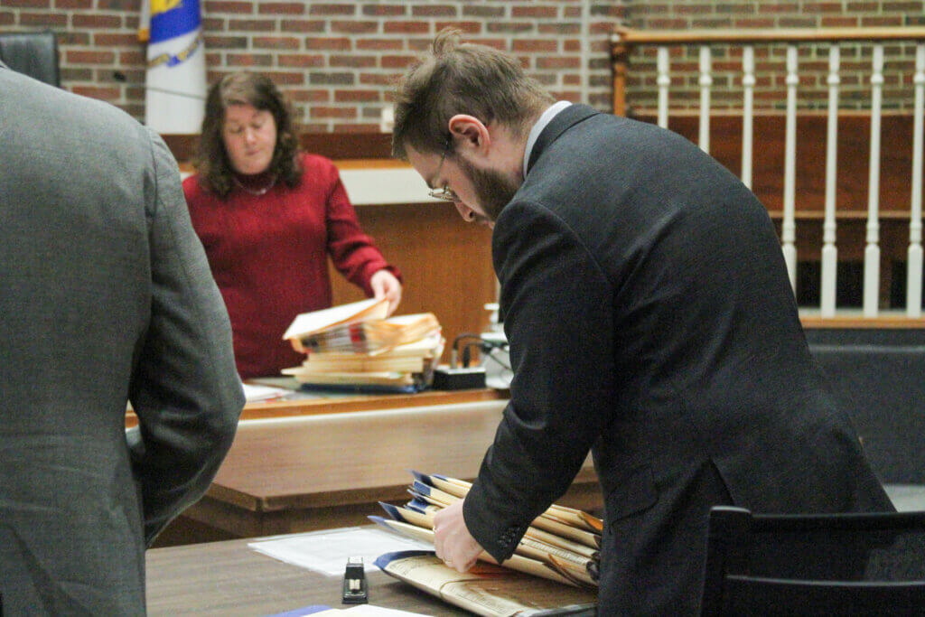 Assistant District Attorney Leon Rotenstein organizes his notes in Acton District Court. Photo: Dakota Antelman/The Acton Bridge