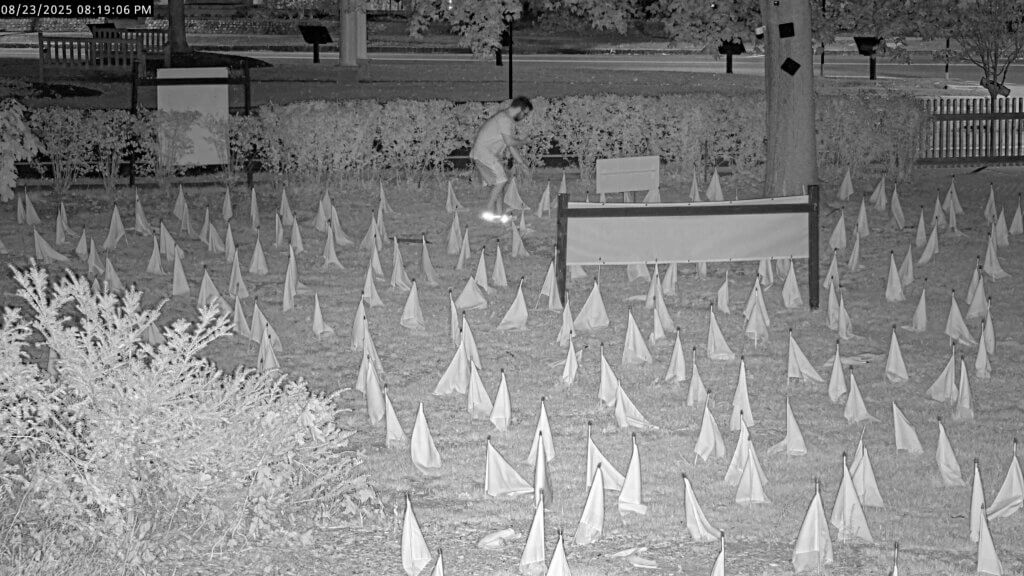 Security cameras captured footage of a person uprooting signs and trampling flags at a memorial to Israeli terrorism victims on Acton Center property owned by the Schwartz family. Image courtesy of Kurt Schwartz
