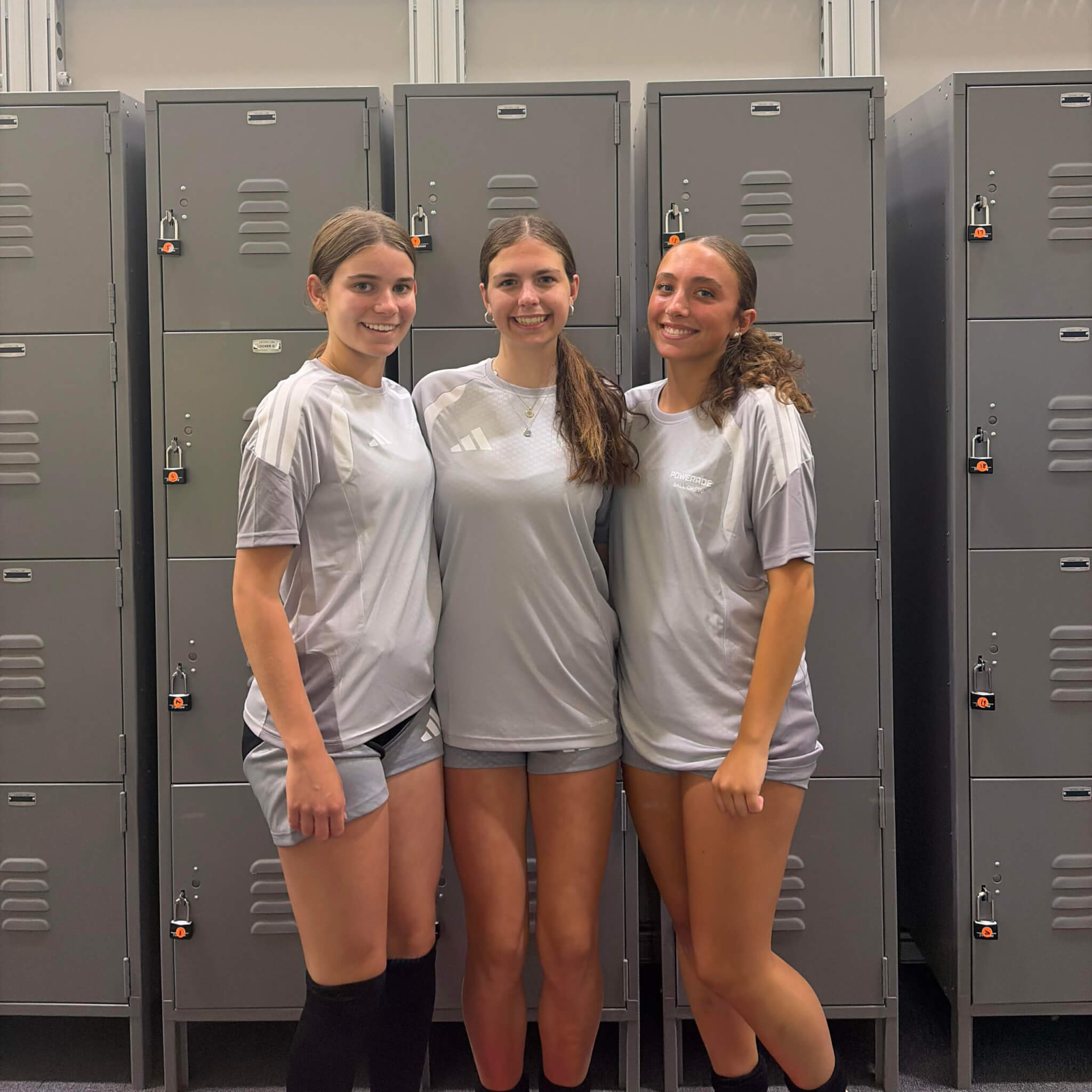 Annie Beal, Emily Perrotta, and Camy Cox pause in the locker room before the Morocco-Scotland game. Photo by Laura Hutchinson