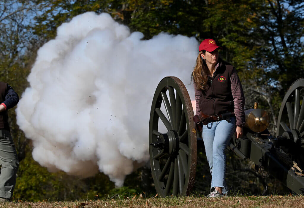 Abigail Myette, the only female in the Acton Independent Battlery, sets off a charge during an Open Practice and Test Fire at the Old Manse Field on Saturday, October 19, 2024. Ken McGagh/The Acton Bridge