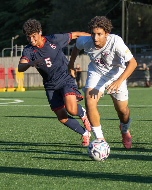 Rayan Boutrig goes upfield against Lincoln-Sudbury on September 18. Photo by Rebecca Woodward