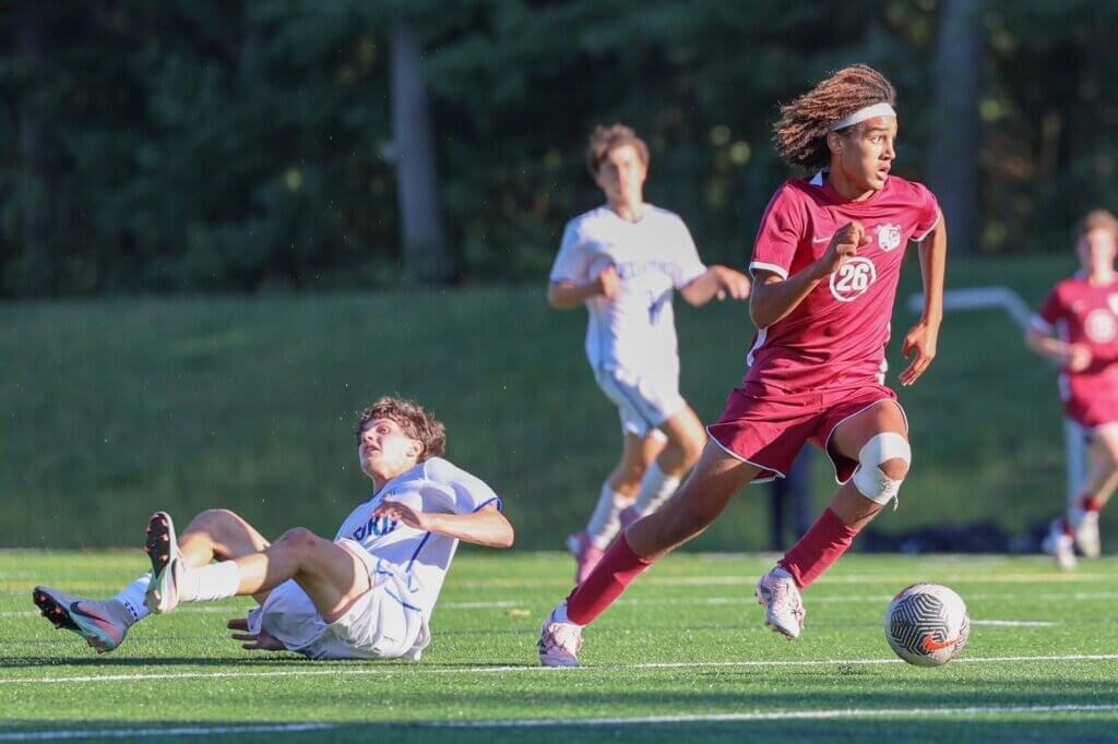 CCHS’ Rory Best charges upfield, leaving a vanquished Bedford opponent in his wake on September 14. Photo by Janel Apuna
