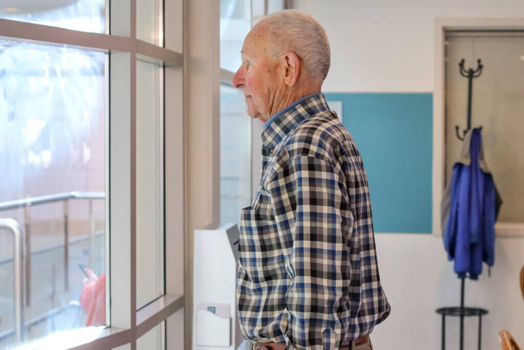 Funkhouser looks out at the pool in the Beede Swim and Fitness Center. Photo: Trace Salzbrenner/Acton Bridge