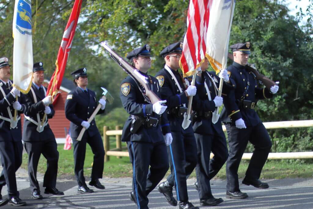 The Acton Fire and Police Honor Guards march with the national and state flags to start the awards ceremony. Photo: Trace Salzbrenner/The Acton Bridge