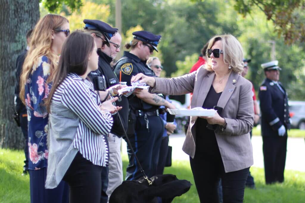 The Rotary Club passes out mementos to each first responder in attendance. Photo: Trace Salzbrenner/The Acton Bridge