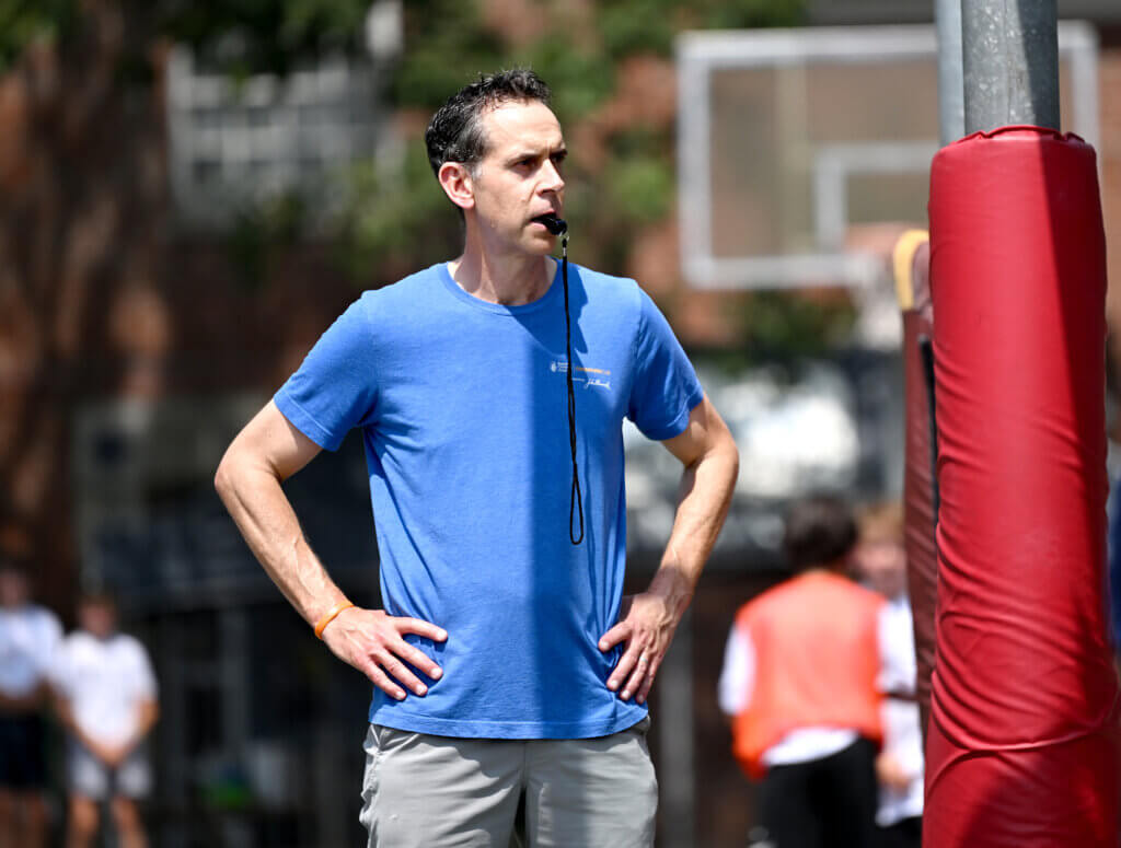 Seth van der Swaagh, the organizer of the 3v3 basketball fundraiser for NMDP, formerly known as the National Marrow Donor Program, and the father of Ewan van der Swaagh, 15, a recipient of two bone marrow transplants through NMDP, officiates a game at Emerson Playground on Saturday, July 26, 2025. $3,100 was raised Saturday. Ken McGagh/The Acton Bridge