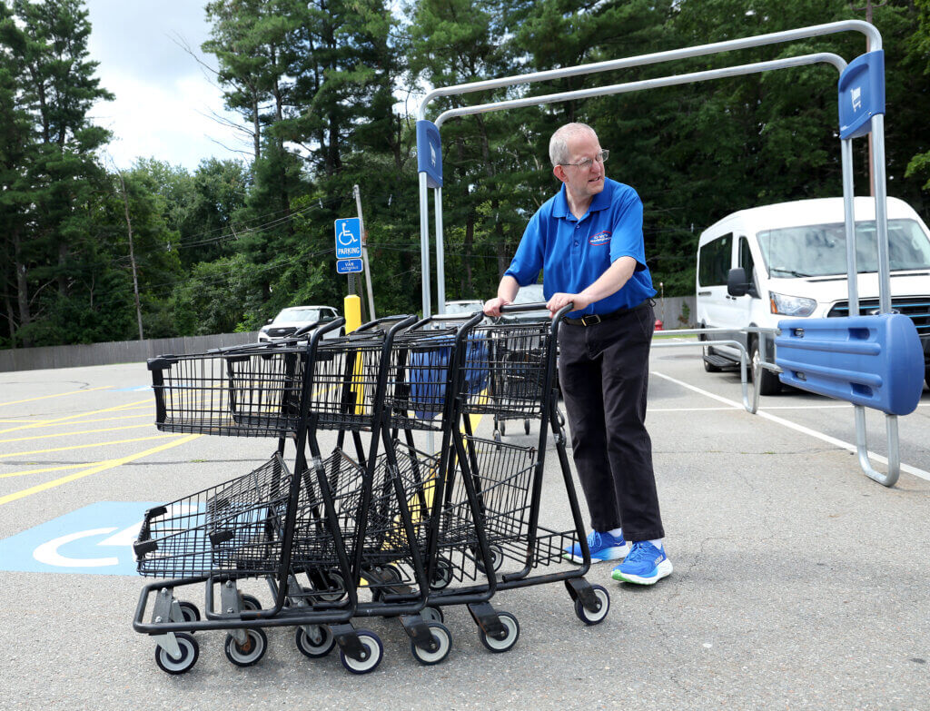 David Inferrera, a thirty-five year veteran at Crosby’s Marketplace, collects shopping carts in the parking lot on Friday, July 31, 2026. Ken McGagh/The Acton Bridge