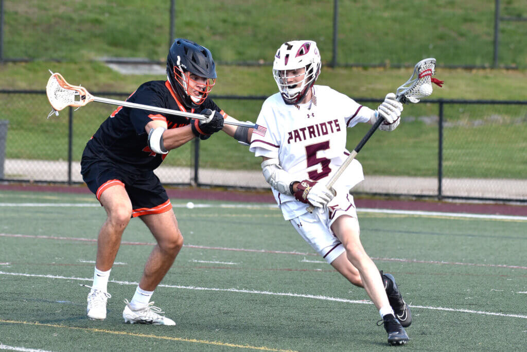 Attack John Anderson gets past his Wayland opponent. Photo by Cris Van Dyke