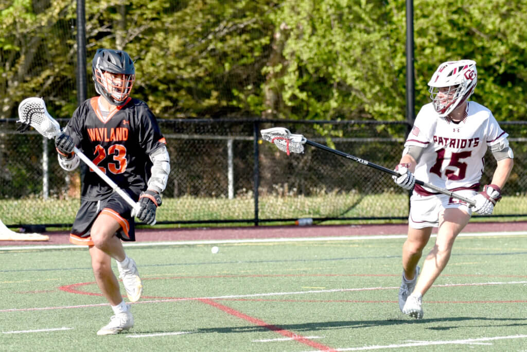Defender Austin Ward keeps pace with an opponent. Photo by Cris Van Dyke
