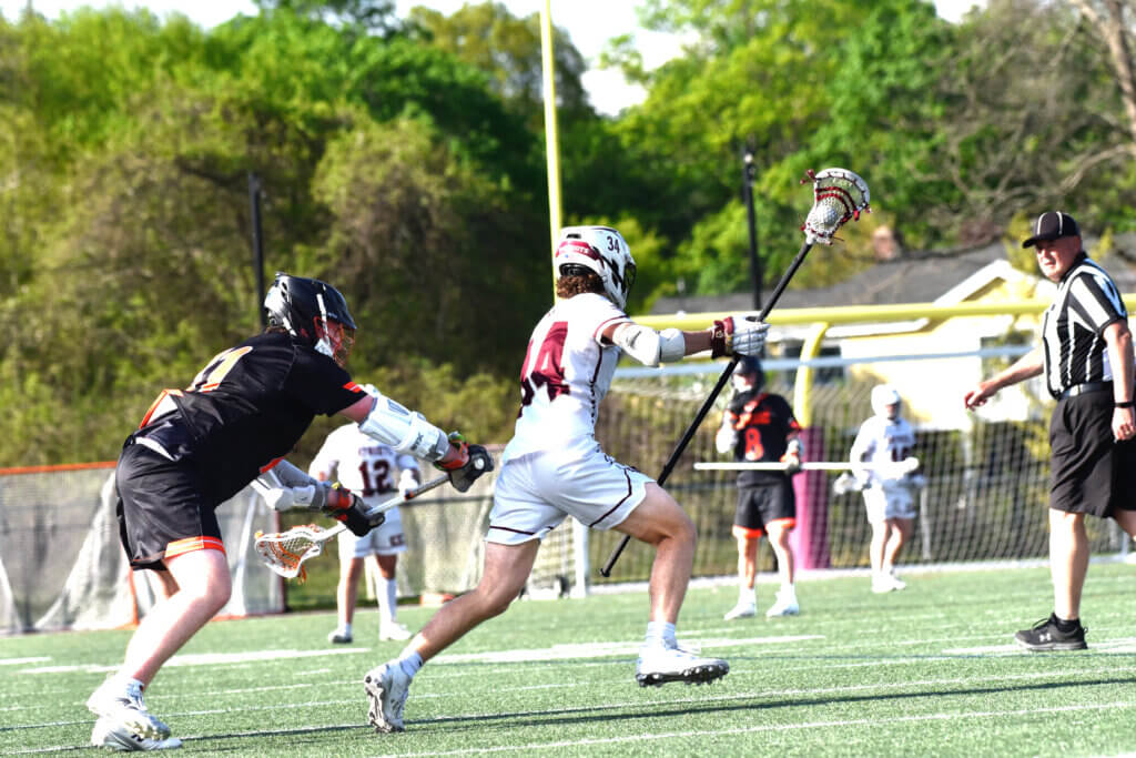Defender Aiden Bayes outruns his Wayland opponent. Photo by Cris Van Dyke