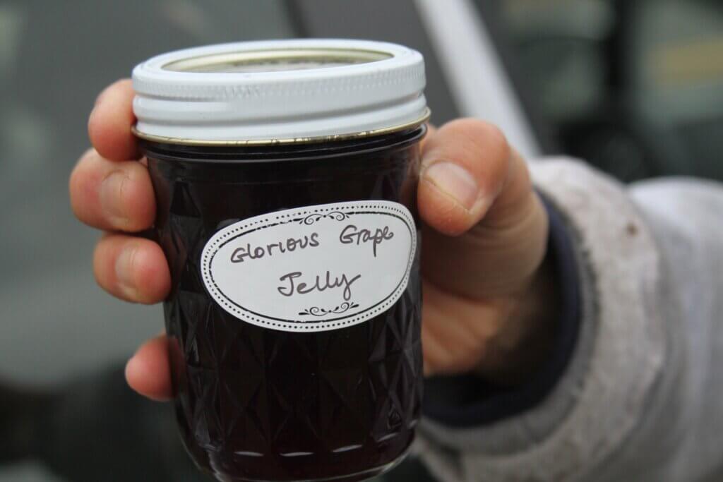 Gardener Lai Chan shows off a batch of grape jelly made from plants already growing at the Hugh Cargill Community Garden. Photo: Dakota Antelman/The Acton Bridge
