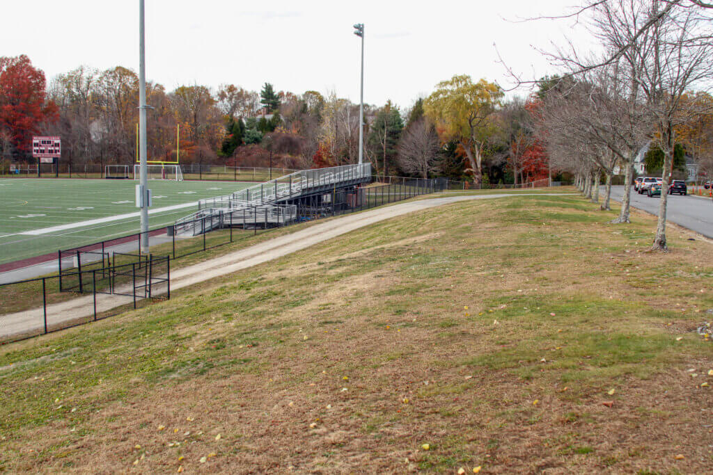 Memorial Field has an entrance with a minimal incline — but it’s far from designated handicap parking. Dakota Antelman/The Acton Bridge