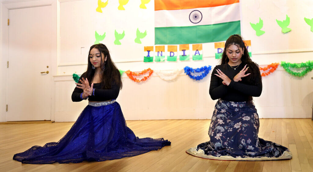 Neha Joshil, 18, a rising college freshman, and Prisha Rachakatla, 19, a rising college sophomore, both of Westford, prepare to dance a medley of Bollywood songs during Acton's second annual India Day celebration at First Parish on August 16, 2025, Ken McGagh/The Acton Bridge