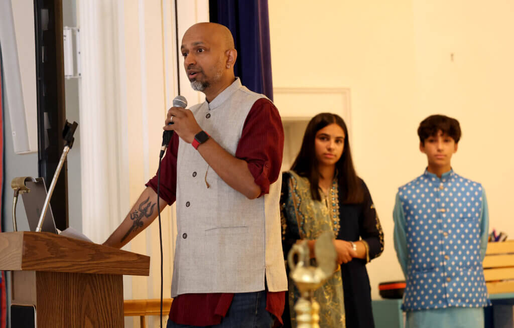Sandeep Pisharody of the Acton School Committee speaks during Acton's second annual India Day celebration at First Parish on August 16, 2025, Ken McGagh/The Acton Bridge