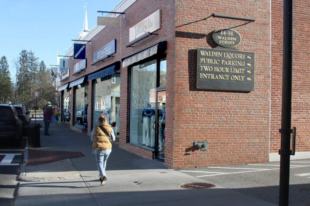 A person walks past the entrance to the Walden Street parking lot, which will be closed beginning at 10 p.m. on April 16. Photo: Dakota Antelman/The Acton Bridge