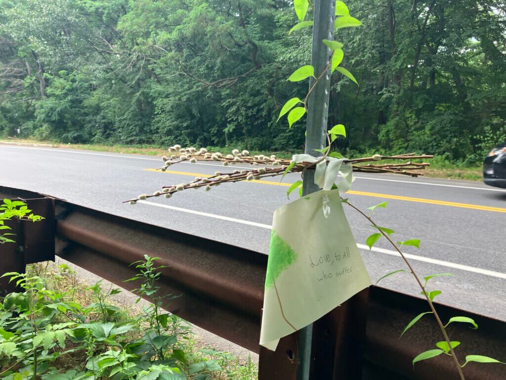 A handwritten condolence message and a sheaf of pussy willows were affixed to a pole near the crash scene Tuesday. Photo: Dakota Antelman/The Acton Bridge