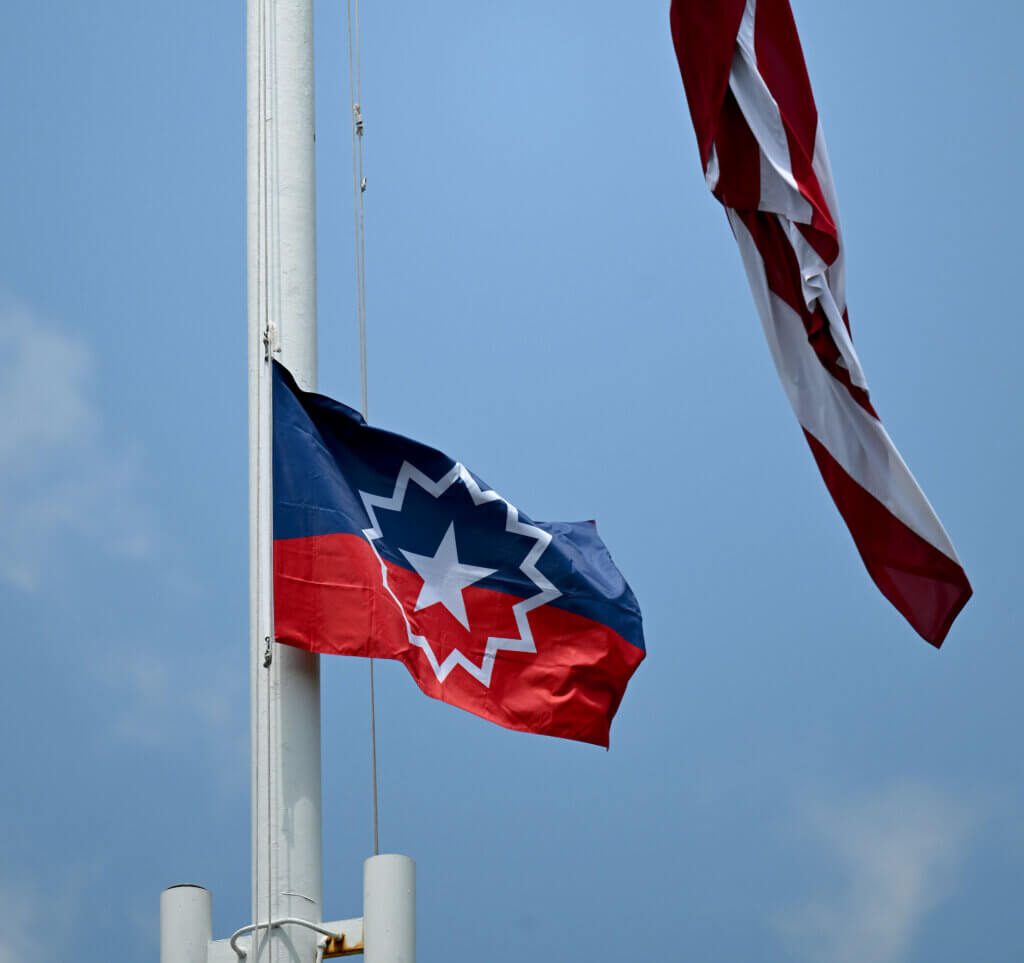 The Juneteenth flag flies above Monument Square.