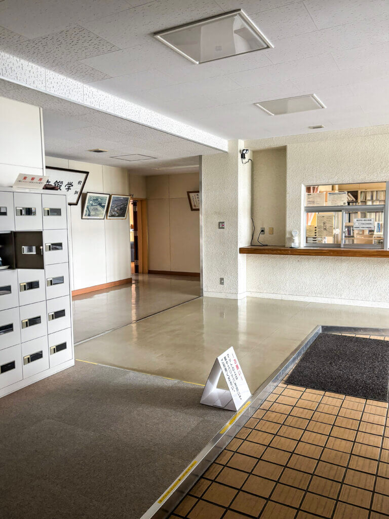 The genkan at Nanae High School is where students and visitors swap outdoor shoes for slippers or indoor shoes before entering. Photo by Emily Aldous