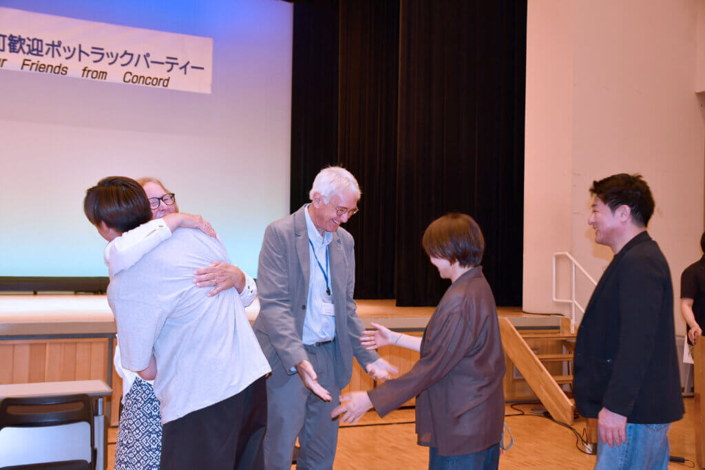 Court and Reyne Booth of the Acton-Nanae Network with the family of Riku, a student they hosted in 2024. Photo courtesy of Jack Brox McCarthy