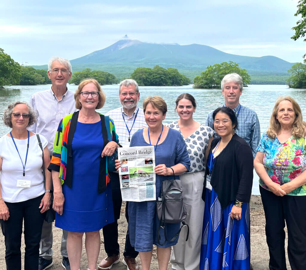 A hometown delegation brought The Bridge to Acton’s sister city of Nanae, Hokkaido, Japan. Pictured left to right: Select Board Clerk Wendy Rovelli, Court and Reyne Booth, state Rep. Carmine Gentile, Select Board member Mary Hartman, Deputy Town Manager Megan Zammuto, CCHS teacher Nouna Pinto, Acton Public Works Director Alan Cathcart, and former Select Board member Terri Ackerman. Photo courtesy of Mary Hartman.