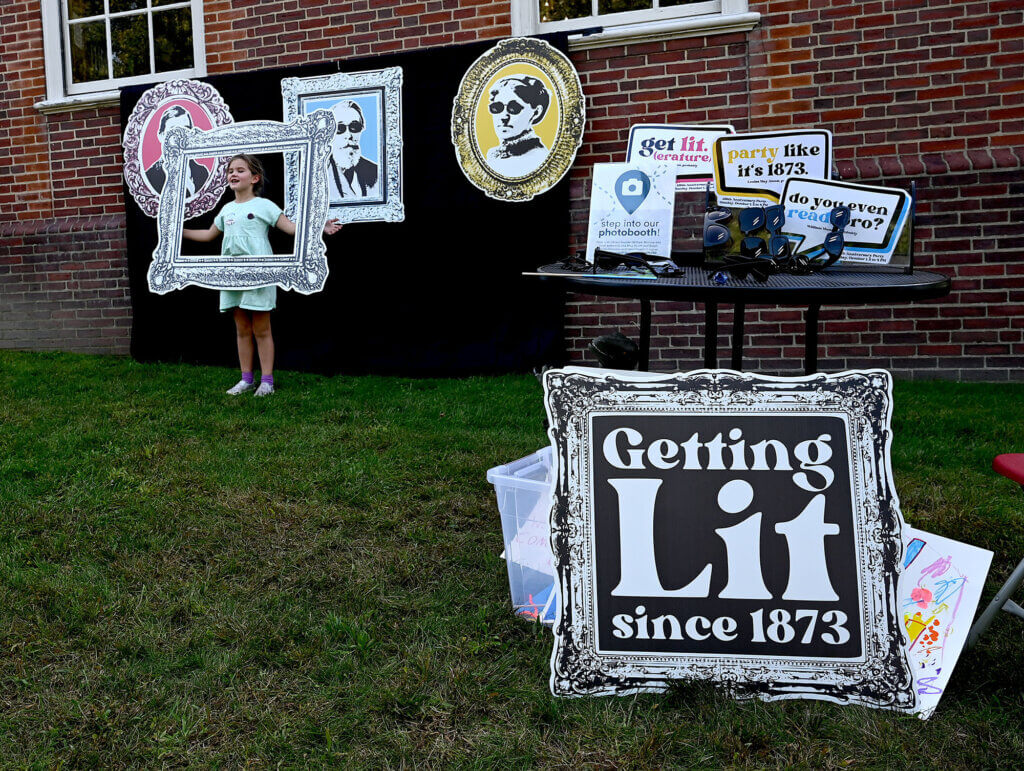 The library set up a photo booth with lots of props for the 150th Anniversary Celebration,  October 1, 2023.  Ken McGagh for The Acton Bridge