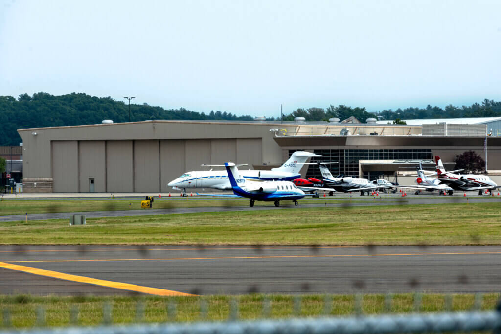 Hanscom Field has been the center of protests over jet hangar expansion and immigration enforcement flights. Photo by Maia Kennedy Photography