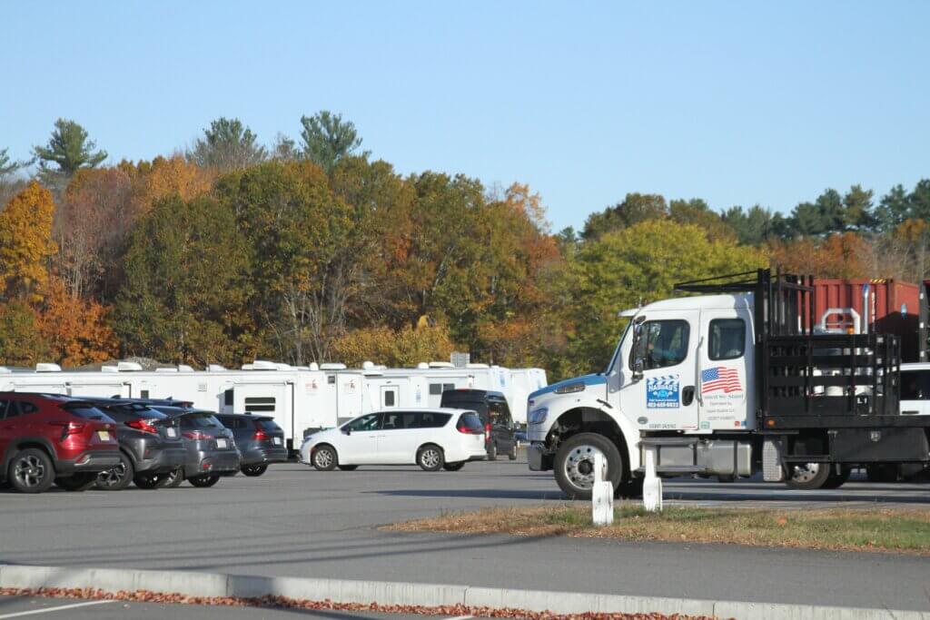 Trucks, trailers, and dozens of cars filled the normally empty MCI-Acton lot Thursday morning. Photo: Dakota Antelman/The Acton Bridge