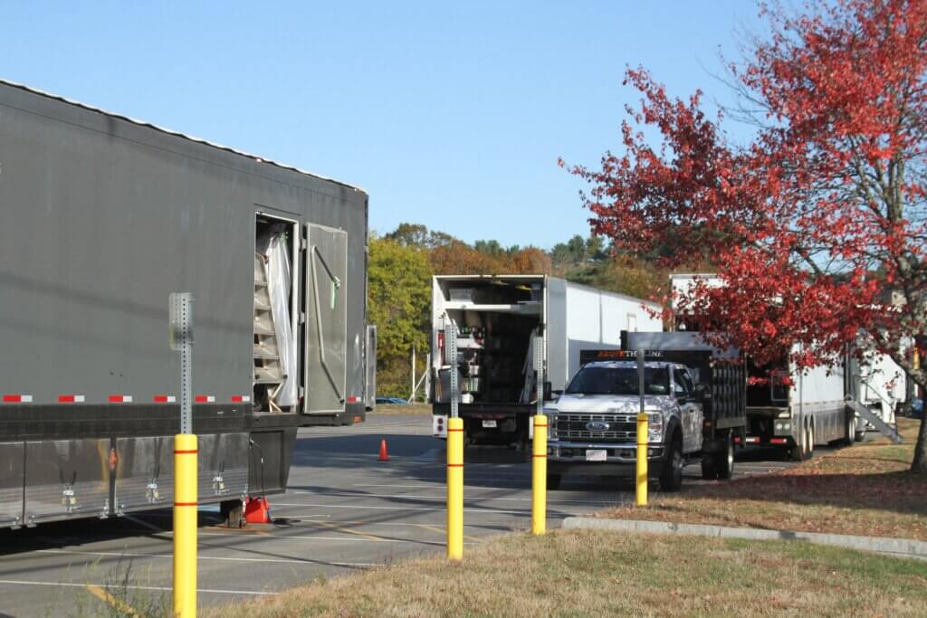 Semis full of production equipment parked on the MCI-Acton campus near the Route 2 Acton rotary Thursday. Photo: Dakota Antelman/The Acton Bridge