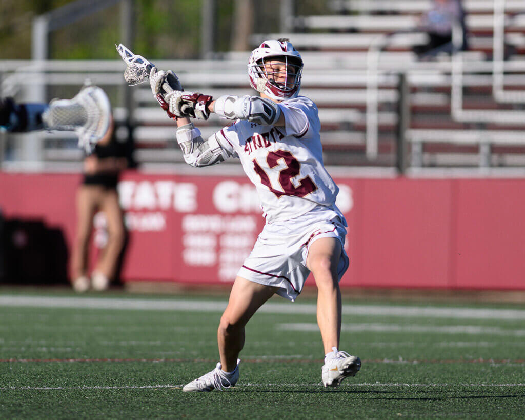 Acton-Carlisle’s Cam Scones winds up during the May 7 match against Westford Academy. Photo by Jon Straggas