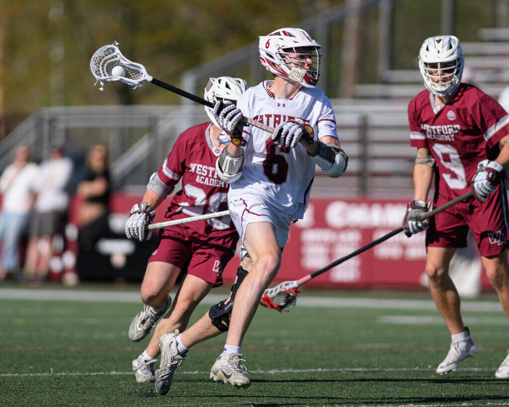 The Patriots’ Tyler Shepard works against Westford Academy on May 7. Photo by Jon Straggas
