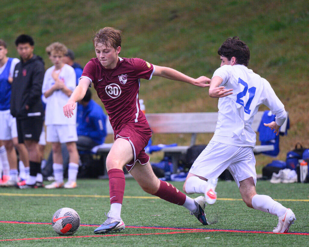CCHS’ Samuel Keener works past Newton South’s Max Coleman during their October 13 game. Photo by Jon Straggas
