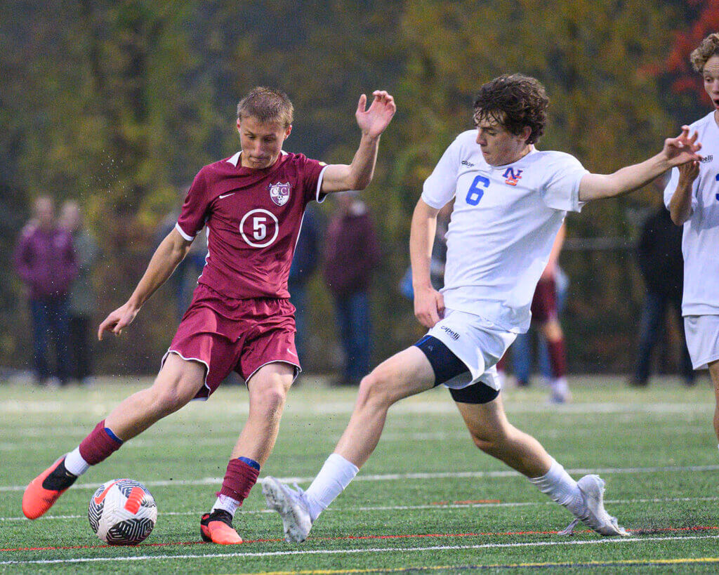 CCHS’ Zach Smith (No. 5) fends off Newton South’s Oliver Harmon (6) during their October 13 game. Photo by Jon Straggas