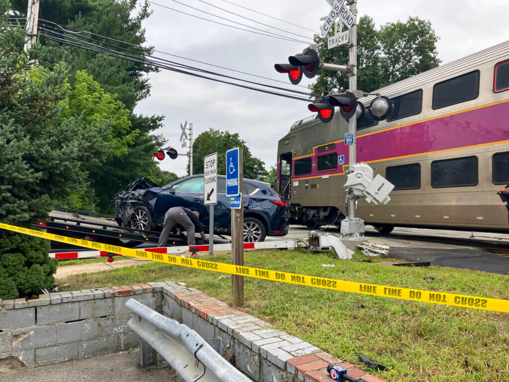 A vehicle that was hit by a train is loaded onto a tow truck. Photo: Dakota Antelman/The Acton Bridge