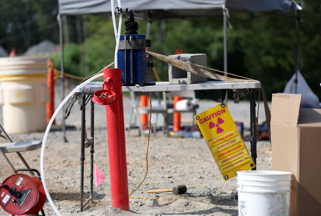 Water is tested from a new monitoring well painted bright red at the 2229 Main Street Superfund Site in Acton on Wednesday, August 13, 2025. Ken McGagh/The Acton Bridge