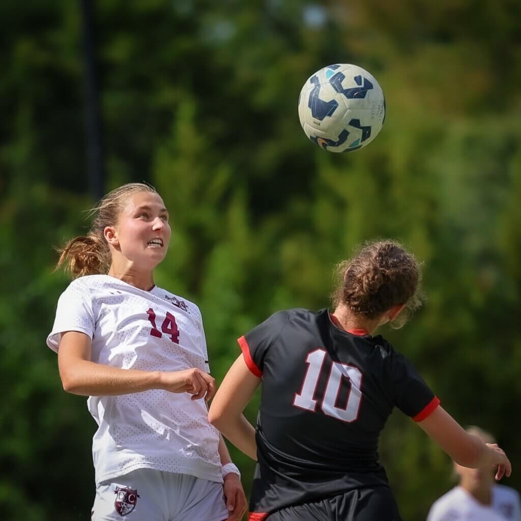 Catherine Kilmartin is laser-focused as she battles a Wellesley opponent. Photo by Janel Apuna