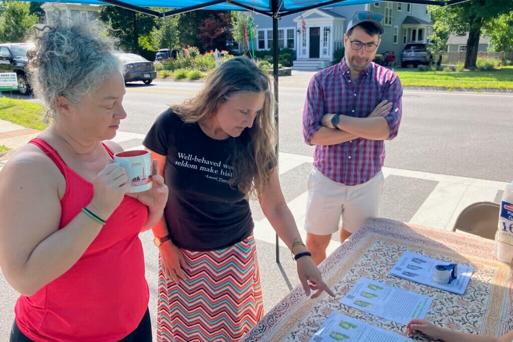 Carlene Hempel, center, discusses pocket park plans with Highland Street neighbors Anna Willis, left, and John Cooley. Photo: Dakota Antelman/The Acton Bridge