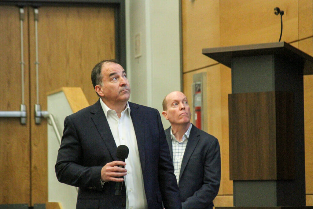 Rotary project manager Anthony Christakis, left, looks at the screen during a public meeting in Acton. Photo: Dakota Antelman/ The Acton Bridge