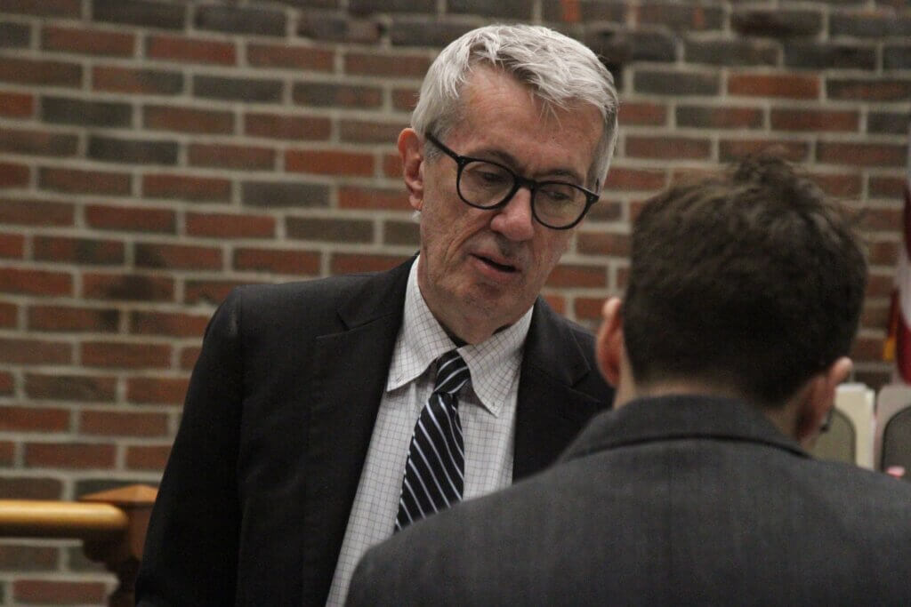 John Grace’s attorney, George King, speaks with a prosecutor from the Middlesex District Attorney’s office. Photo: Dakota Antelman/The Acton Bridge
