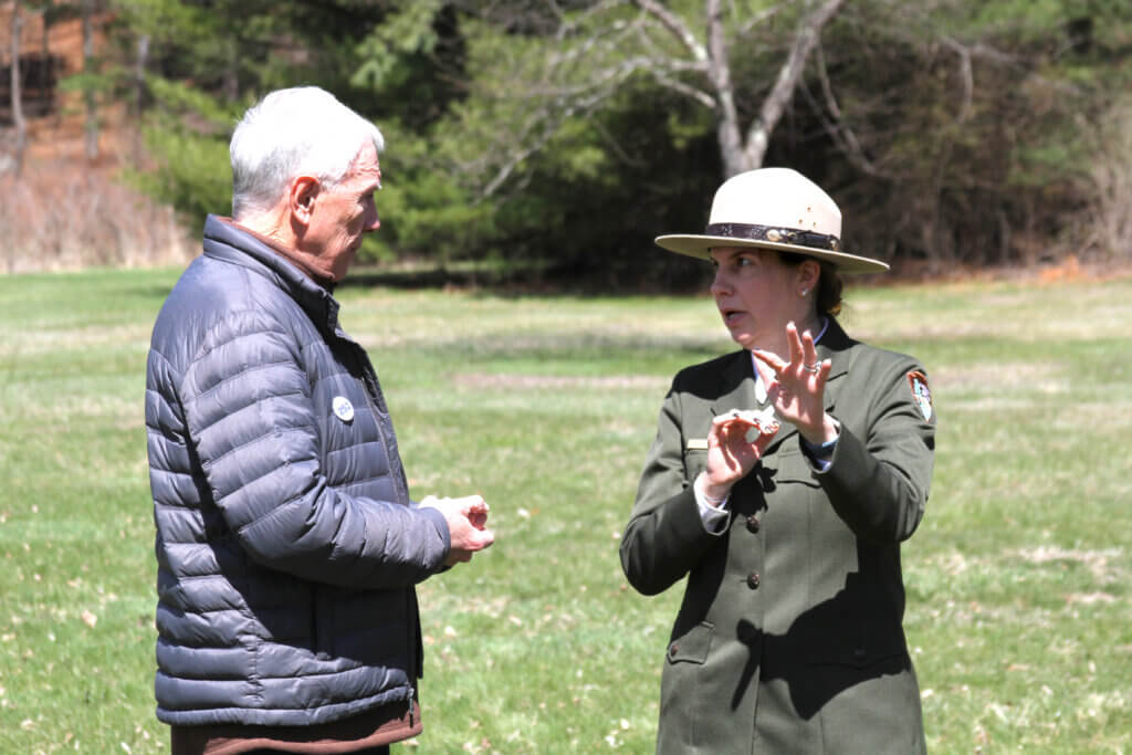 Concord250 Executive Committee co-chair Gary Clayton speaks with Minute Man National Historical Park superintendent Simone Monteleone. Photo: Dakota Antelman/The Acton Bridge