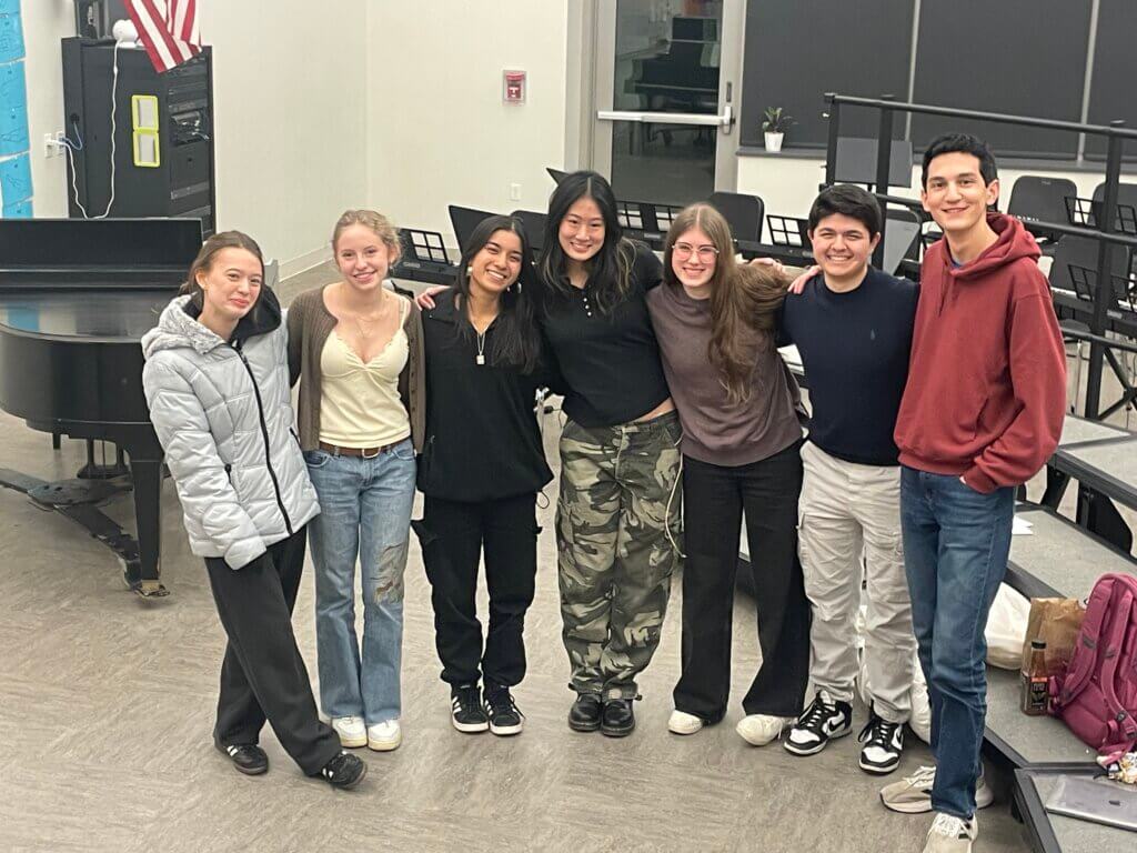 Acton-Carlisle High School’s a cappella group Take Notes will perform at EmerSong. Left to right are Joanna Steanz, Paloma Wigton, Celeste Pinto, Marilyn Teng, Tessa Houston-Fuller, James Feinberg, and Charles Mastromarino. Courtesy photo