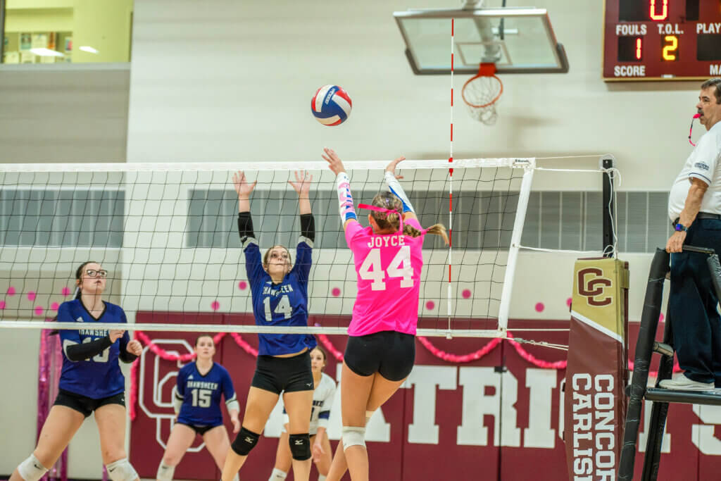 Summer Simek (No. 44) sets the ball to help carry Acton-Carlisle to victory against Shawsheen Tech on September 25. Photo by Rocco Micciche