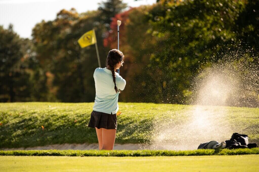 CCHS co-captain Sophie Redmond pitches out of a sandtrap. Redmond fired two holes-in-one, on September 17 and October 1. Photo by Rocco Micciche