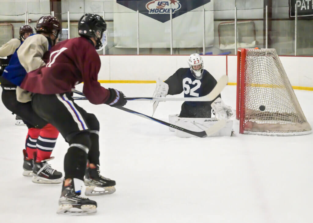 Patriots goalie Max Furman makes a save. Photo by David Clancy