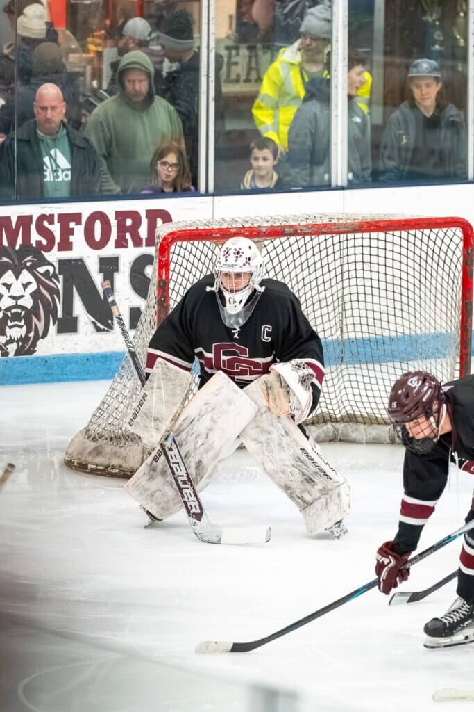 Co-captain Sam Griswold defends the Patriots’ goal. Photo by Aidan Moroney