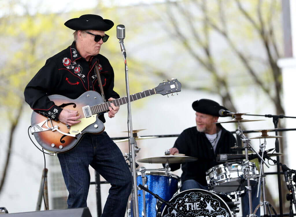 Dave Foley, left, and drummer Dave Matthews rock out on the main stage during the block party.
