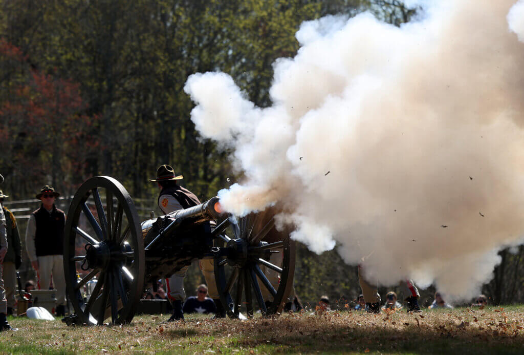The Acton Independent Battery fires a cannon salute during Patriots Day ceremonies at North Bridge on Monday. Photos by Ken McGagh/The Acton Bridge 
