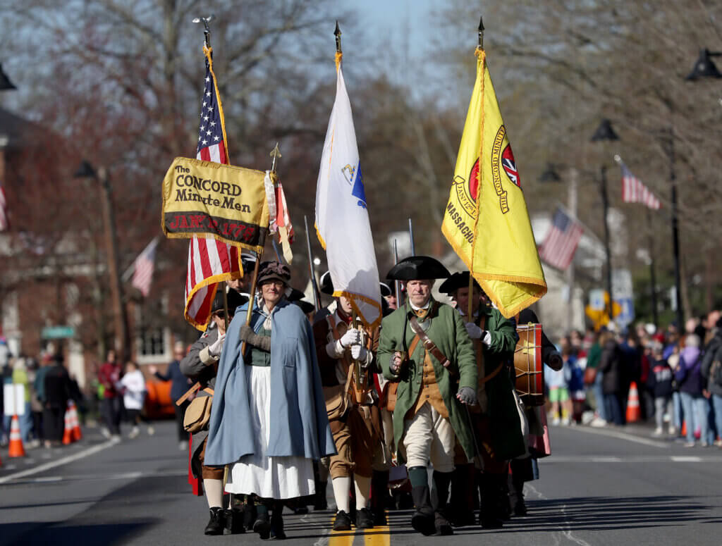 The Acton Minute Men march in the Patriots Day parade. 
